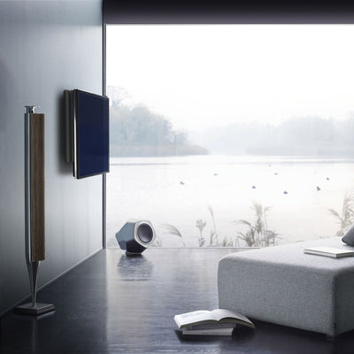 BeoLab 18 speakers sit within a modern room playing music