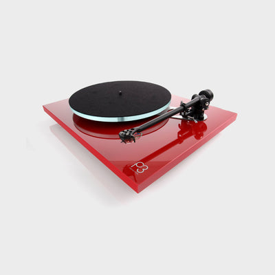 Gloss red turntable made by Rega called the Planar 3